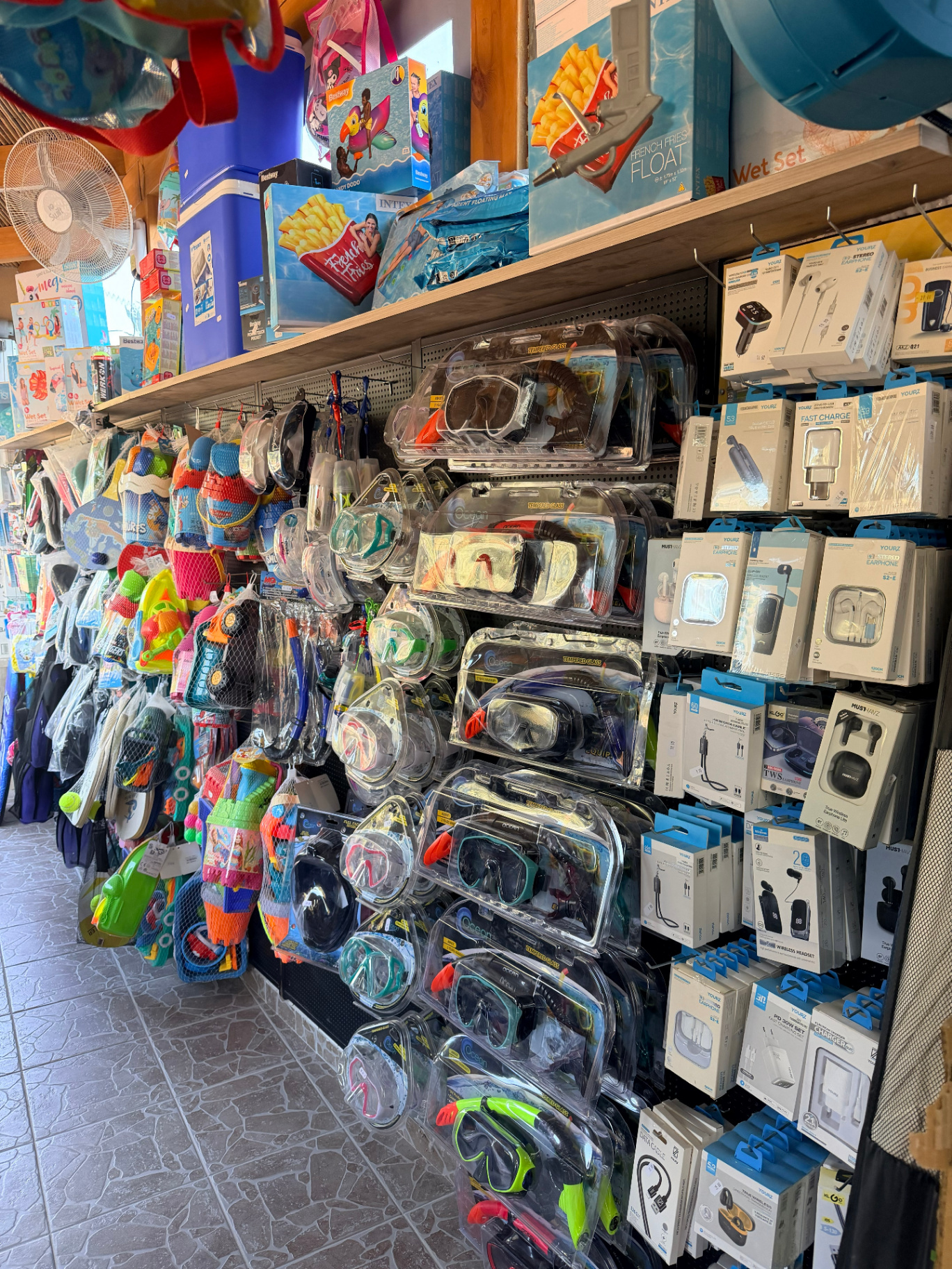 Snorkel masks tempered glass diving goggles and beach toys at AMOS SEASIDE Mini Market Marathi Beach Chania