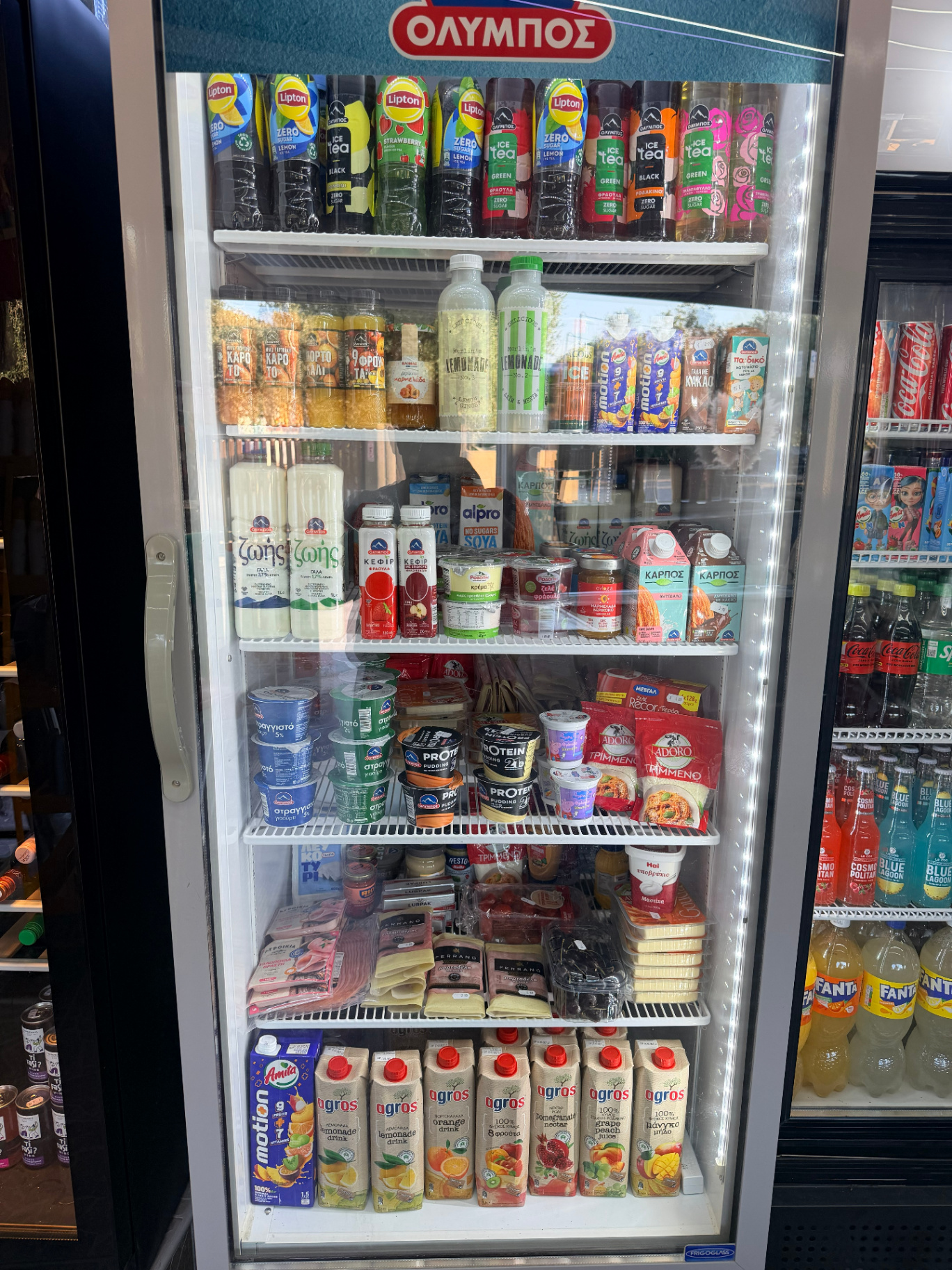 Olympos dairy fridge with Greek yogurt milk ice tea and juices at Marathi mini market Chania